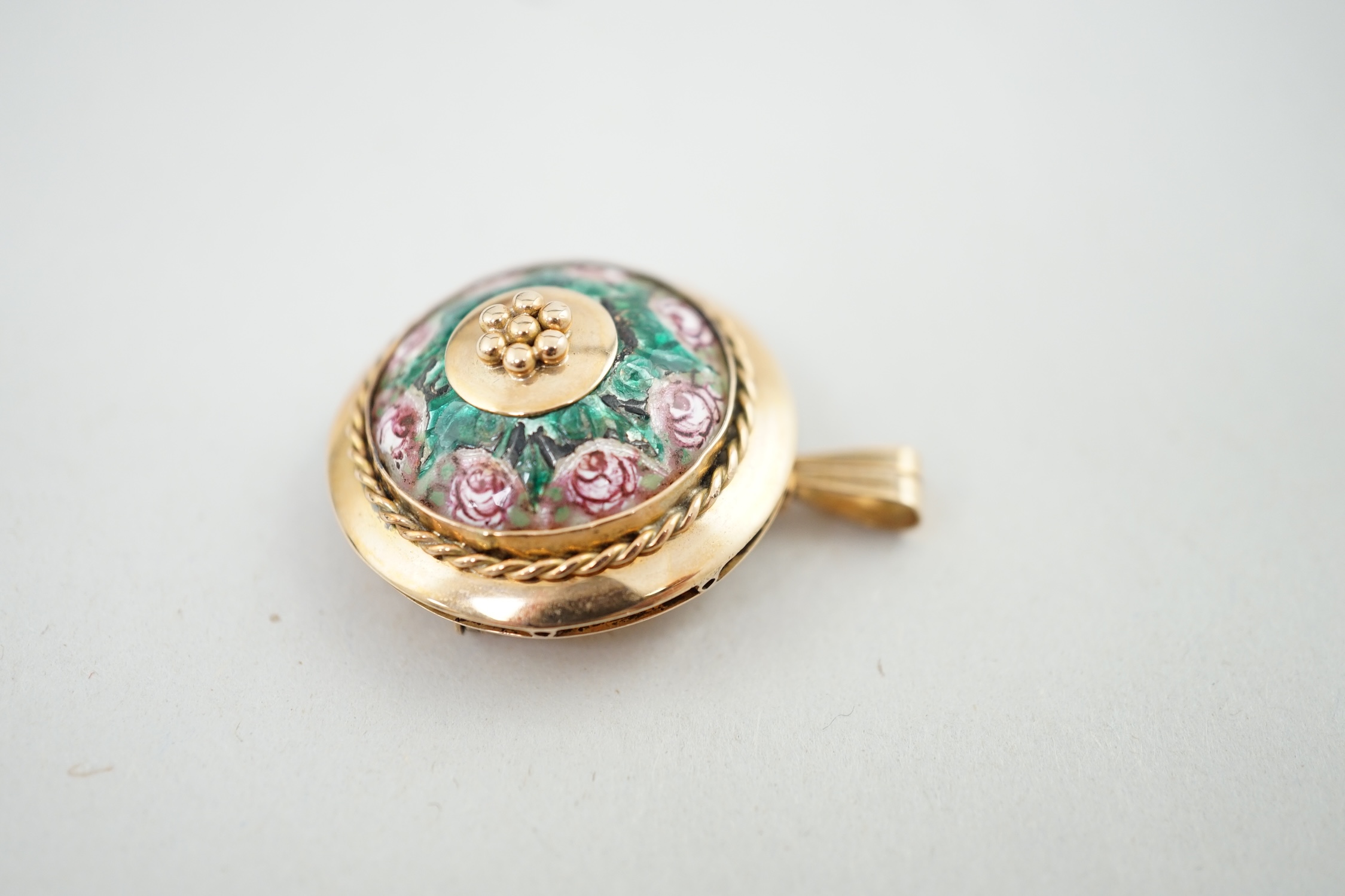 A mid 20th century 14k gold and two colour enamel set circular pendant brooch